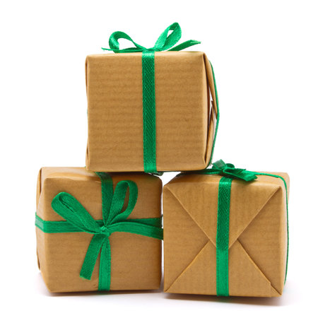 Pile of Gift boxes wrapped in brown paper isolated on white.の写真素材