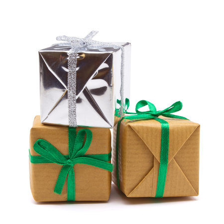 Pile of Gift boxes wrapped in brown paper isolated on white.の写真素材