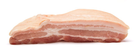 Slab of raw belly pork from low perspective isolated on white.の写真素材