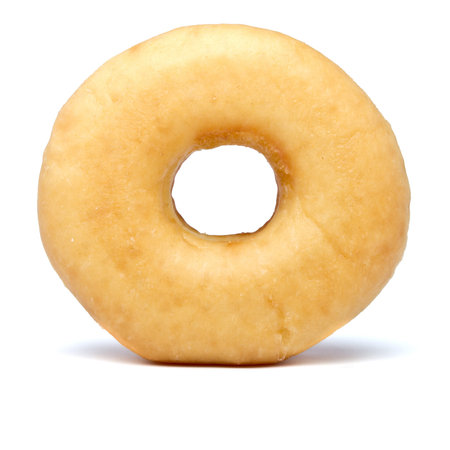 Single sugared plain doughnut from low perspective.の写真素材