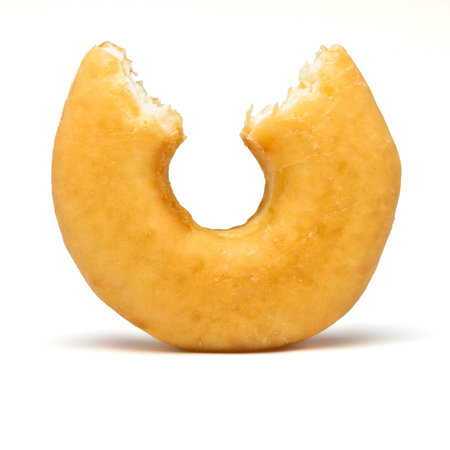 Single donut with bite out from low perspective.の写真素材