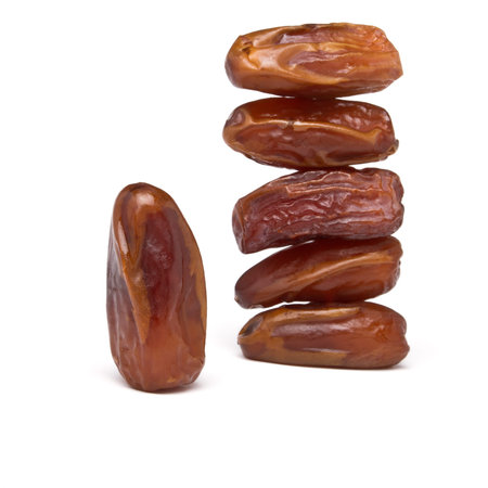 Abstract stack of date fruits on white background.の写真素材