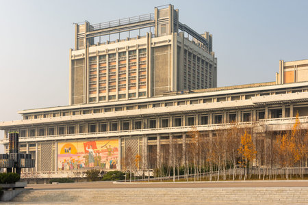 Pyongyang / DPR Korea - November 12, 2015: Building decorated with revolutionary symbols and slogans...
