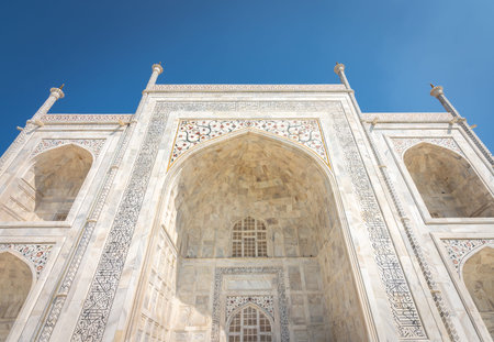 Facade details in the white marble of the Taj Mahal mausoleum built in 1643 by Mughal emperor Shah Jahan to house the tomb of his wife Mumtaz Mahal in Agra, Uttar Pradesh, Indiaの写真素材