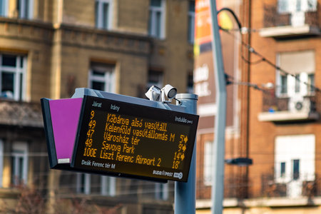 Budapest / Hungary - October 20, 2018: Digital bus stop timetable display board announcing bus...