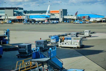 Amsterdam / Netherlands - October 7, 2018: Airport baggage tractor at Amsterdam Airport Schiphol in Amsterdam, Netherlandsのeditorial素材