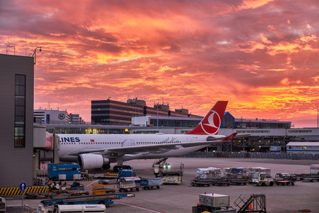 Amsterdam / Netherlands - October 15, 2018: Vibrant fiery sunset sky above the Amsterdam Airport...