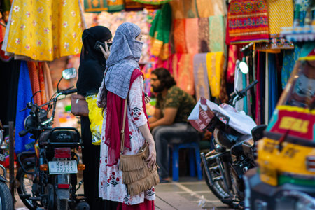 Jaipur, Rajasthan / India - September 28, 2019: Rajasthani girls in headscarves at Bapu Bazar in Jaipur, famous Jaipur market for buying traditional Sarees, Scarves and other goodsのeditorial素材