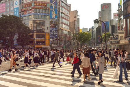 Tokyo / Japan - April 20, 2018: People crossing the famous Shibuya intersection in Tokyo, Japan
