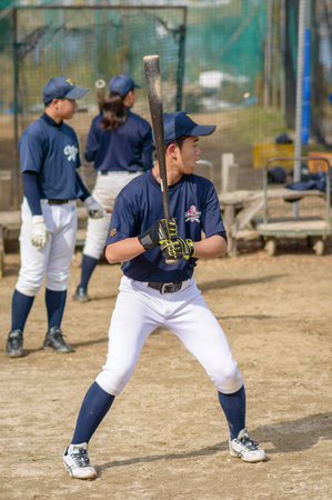 Osaka / Japan - November 25th 2017: Japanese baseball players practicing on a filed in Osaka, Japan