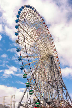 Osaka / Japan - December 25, 2017: Tempozan Ferris Wheel in Osaka, Japan, next to Osaka Aquarium Kaiyukan, one of the tallest Ferris wheels in the world with a height of 112.5 metresのeditorial素材