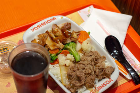 Beijing / China - August 8, 2016: Set meal at Yoshinoya, Japanese multinational fast food chain of gyudon (beef bowl) restaurants in Beijing, Chinaのeditorial素材