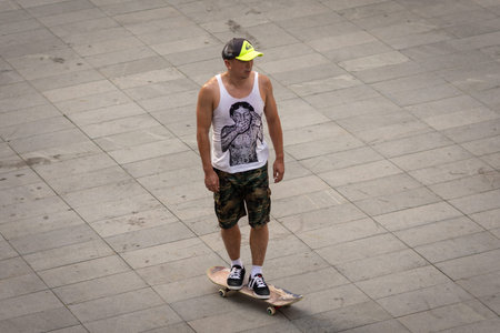 Beijing / China - August 21, 2016: Skater with a skateboard in modern Sanlitun area of Chaoyang district in central Beijing, Chinaのeditorial素材