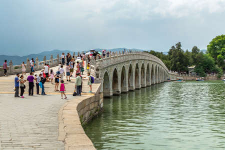 Beijing / China - June 6, 2015: Seventeen-Arch Bridge (Shiqikong Qiao) in the Summer Palace, complex of lakes, gardens, pavilions and palaces in Beijing, Chinaのeditorial素材