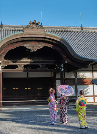 Kyoto / Japan - November 12, 2017: Girls in traditional Japanese kimonos at Shogun residence of Nijo castle in Kyoto, Japanのeditorial素材