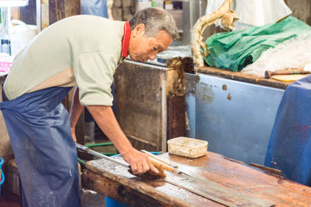 Tokyo / Japan - October 21, 2017: Tsukiji fish market in Tokyo, largest wholesale fish and seafood market in the world, handling over 2,000 tons of marine products per dayのeditorial素材