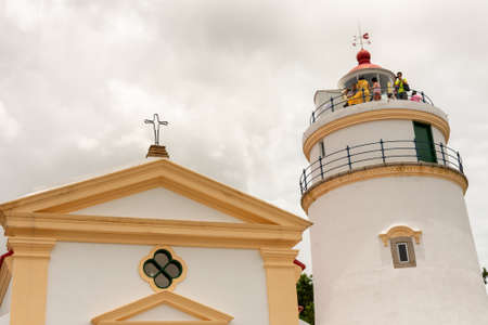 Macau (Macao SAR) / China - July 26, 2015: Capela de Nossa Senhora da Guia and Guia Lighthouse at the Guia Fortress in Macau, China. UNESCO World Heritage Site.のeditorial素材