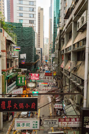 Hong Kong / China - July 23, 2015: Neon signs advertising stores in a busy street in Hong Kongのeditorial素材