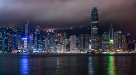 Hong Kong / China - July 26, 2015: Panoramic night view of Hong Kong skyline across Victoria Bay