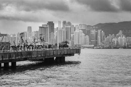 Hong Kong / China - July 23, 2015: People view the Iconic Hong Kong city skyline from Tsim Sha Tsui Promenadeのeditorial素材