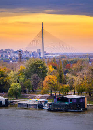 Belgrade / Serbia - November 16, 2019: Colorful sunset over Sava river in Belgrade, capital of Serbia, with Ada bridge in the backgroundのeditorial素材