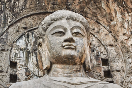 The Longmen Grottoes, Longmen Caves with statues of Buddha and his disciples carved in stone in...