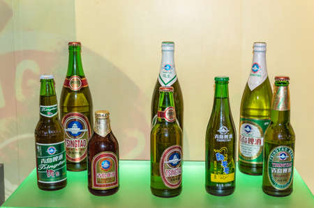 Qingdao / China - August 6, 2015: Different packaging of Tsingtao Beer exhibited at Qingdao Beer Museum and Tsingtao Beer Brewery in Qingdao, Shandong Province, Chinaのeditorial素材