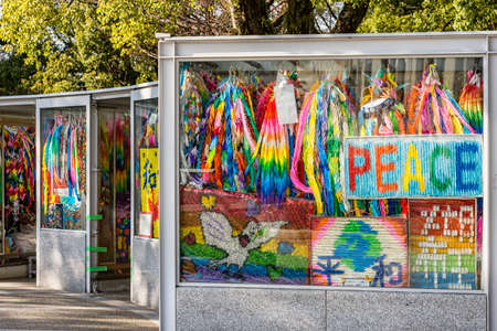 Hiroshima / Japan - December 21, 2017: Brightly colored paper cranes at the Children's Peace Monument to commemorate Sadako Sasaki and thousands of child victims of the atomic bombing of Hiroshimaのeditorial素材
