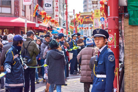 Kobe / Japan - February 17, 2018: Security officer in Chinatown in Kobe, Japan, during Lunar New Year celebrationのeditorial素材