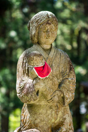 Buddhist sculpture in the Okunoin cemetery in Koyasan Mount Koya, UNESCO world heritage site and a 1200 years old center of Japanese sect of of Shingon Buddhism, Japanのeditorial素材
