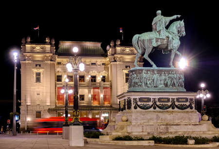 Belgrade / Serbia - November 2, 2019: Statue of Prince Mihailo Obrenovic and the National Theater of Serbia in the Republic Square in Belgrade, Serbia, at nightのeditorial素材