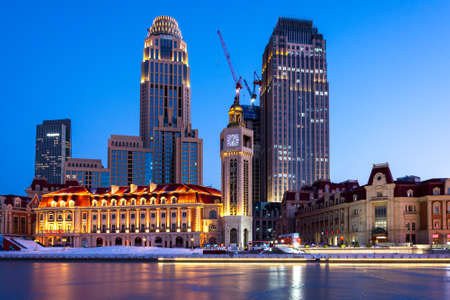 Tianjin / China - February 14, 2016: Evening view of Tianjin Old Concession waterfront and frozen Haihe riverのeditorial素材
