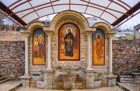 Fruska Gora, Vojvodina / Serbia - January 26, 2020: Water tap with frescoes at the Petkovica...