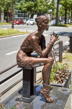 Osaka / Japan - May 5, 2018: Artistic bronze sculpture on Midosuji avenue in central Osaka, Japanのeditorial素材