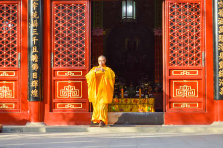 Beijing / China - February 2, 2014: Buddhist monk performing ritual at Fayuan Temple, constructed in 645, one of the oldest Buddhist temples in Beijing and seat of the Buddhist Academy of Chinaのeditorial素材