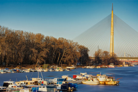 Belgrade / Serbia - January 15, 2017: The Ada Bridge, a cable-stayed bridge over the frozen Sava...