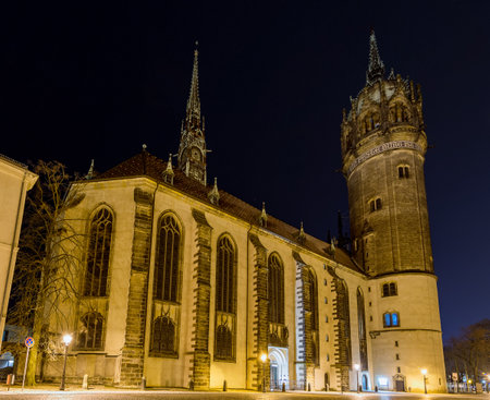 Wittenberg / Germany - February 25, 2017: Night view of All Saints Church or Schlosskirche (Castle Church) in Wittenberg, where the Ninety-five Theses were posted by Martin Luther in 1517のeditorial素材