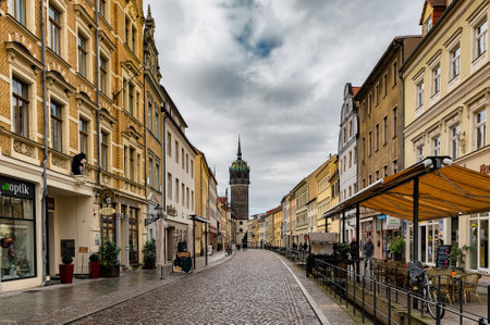Wittenberg / Germany - February 26, 2017: Old street and buildings in Wittenberg, with All Saints Church (Schlosskirche ), where the Ninety-five Theses were posted by Martin Luther in 1517のeditorial素材