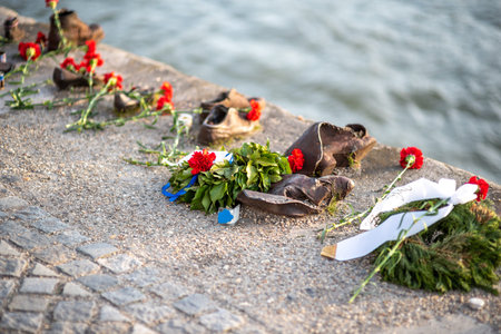 Shoes on the Danube Bank memorial in Budapest, Hungary, dedicated to the memory of the Jews who were killed by fascists during World War II, 1 May 2023のeditorial素材