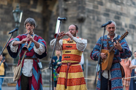 Sunrise parade medieval historic reenactment to commemorate 667th anniversary of laying the foundation stone of iconic Charles Bridge in Prague, Czech Republic, on 9 July 2024のeditorial素材