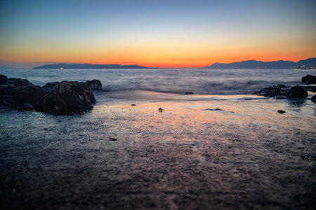 Colorful sunset on Makarska Riviera, popular touristic coastline of the Adriatic Sea in Split-Dalmatia County of the Republic of Croatiaの写真素材