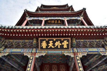 Tower of Buddhist Incense (Foxiangge) on the Longevity Hill of The Summer Palace, complex of gardens and palaces in Beijing, China on 20 April 2024の写真素材