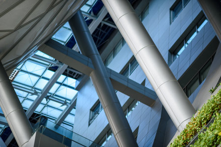 Modern architectural interior with steel columns and glass roofの写真素材