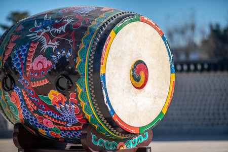 Traditional Korean drum with colorful dragon design outdoors in Seoul, South Koreaの写真素材