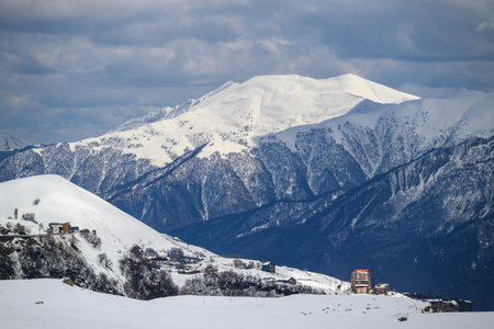 Snowcapped peaks of Caucasus mountains along the Georgian Military Road, major route from Georgia to Russia connecting Tbilisi and Vladikavkazの写真素材