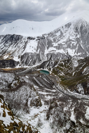 Snowcapped peaks of Caucasus mountains along the Georgian Military Road, major route from Georgia to Russia connecting Tbilisi and Vladikavkazの写真素材