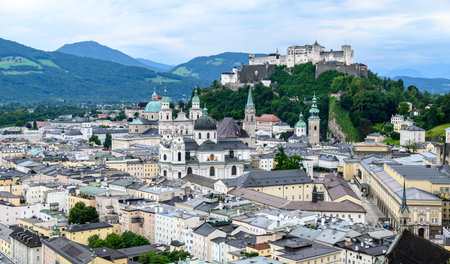 Historic old town of Salzburg and Hohensalzburg Fortress atop the Festungsberg hill in Salzburg, Austria on 10 July 2025の写真素材
