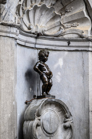 Manneken Pis landmark bronze fountain sculpture fountain in central Brussels, Belgium on 15 July 2025の写真素材