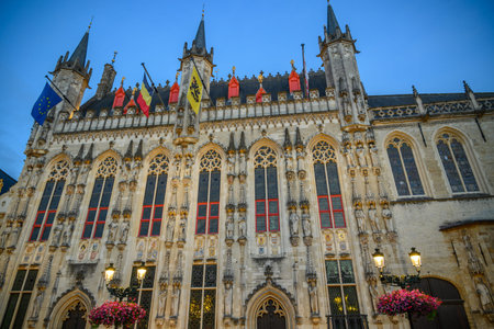 Evening view of Historic Bruges City Hall building on Burg Square in Bruges, West Flanders, Belgium...
