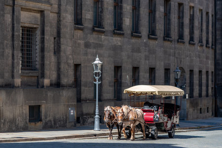 Horse drawn carriage, popular form of sightseeing for tourists visiting historic Old town district...